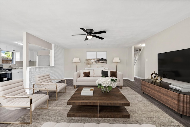 9110 Vickijohn Dr, Houston, TX 77031 - living room with wood finished floors, a ceiling fan, and baseboards