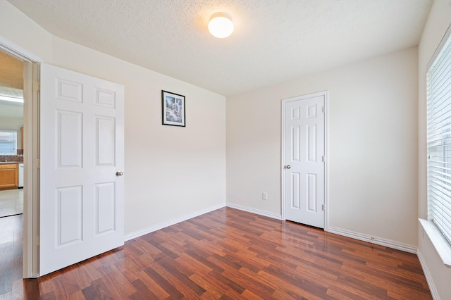 20130 Laramie River Trl, Katy, TX 77449 - unfurnished bedroom featuring dark wood finished floors and baseboards