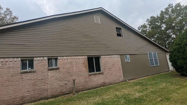 12343 Haroldson Forest Dr, Houston, TX 77044 - view of side of property with a lawn