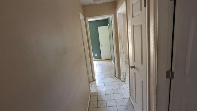 12343 Haroldson Forest Dr, Houston, TX 77044 - hallway with light tile patterned flooring