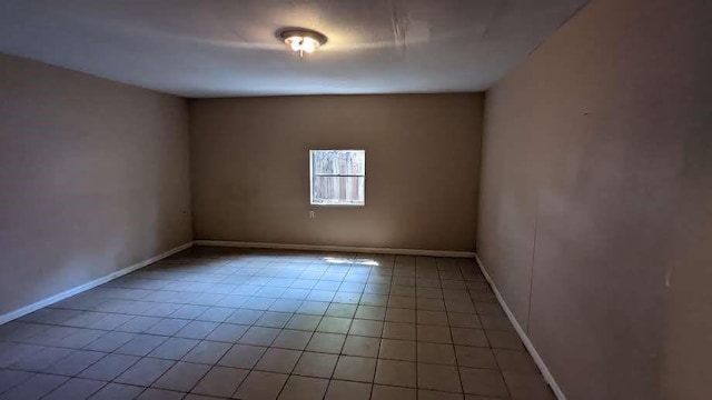 12343 Haroldson Forest Dr, Houston, TX 77044 - unfurnished room featuring light tile patterned floors and baseboards