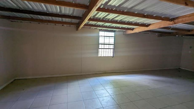 12343 Haroldson Forest Dr, Houston, TX 77044 - below grade area with baseboards and tile patterned flooring