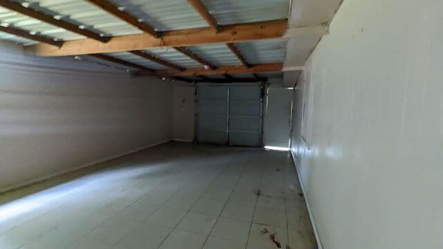 12343 Haroldson Forest Dr, Houston, TX 77044 - garage featuring baseboards