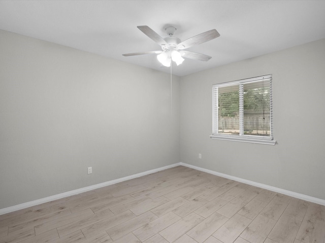 618 Forest Lake Dr, Seabrook, TX 77586 - empty room with light wood finished floors, a ceiling fan, and baseboards