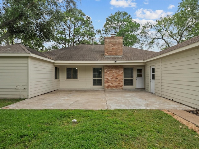 618 Forest Lake Dr, Seabrook, TX 77586 - back of property featuring a chimney, a yard, a patio area, and a shingled roof