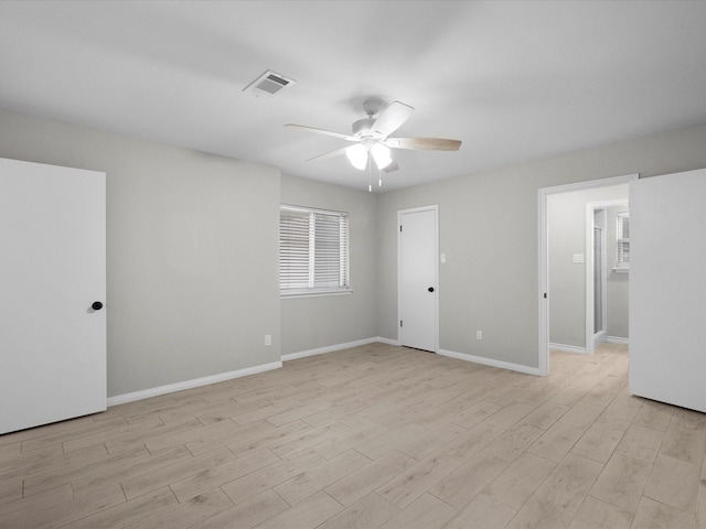 618 Forest Lake Dr, Seabrook, TX 77586 - spare room featuring ceiling fan, light wood-style floors, and baseboards