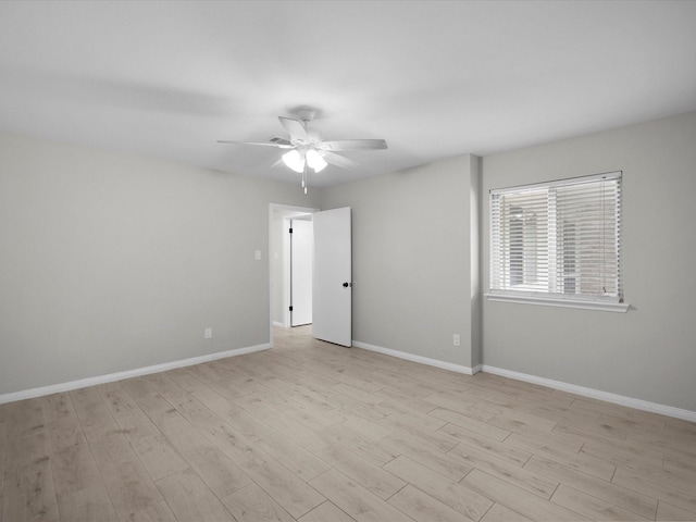 618 Forest Lake Dr, Seabrook, TX 77586 - unfurnished room with light wood-style flooring, a ceiling fan, and baseboards