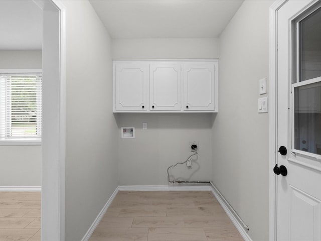 618 Forest Lake Dr, Seabrook, TX 77586 - laundry area featuring hookup for an electric dryer, washer hookup, cabinet space, and baseboards