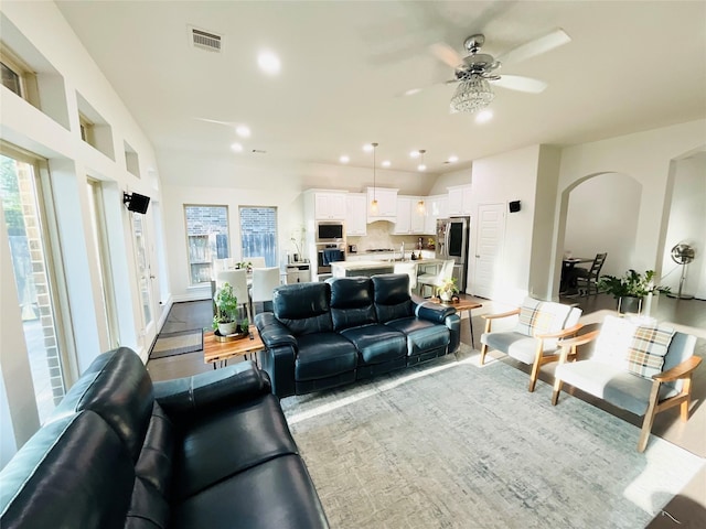 2507 Elmwood Trl, Katy, TX 77493 - living room featuring ceiling fan, arched walkways, and recessed lighting