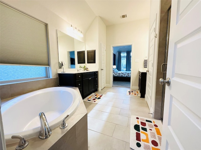 2507 Elmwood Trl, Katy, TX 77493 - full bathroom featuring ensuite bathroom, a bath, vanity, tile patterned flooring, and healthy amount of natural light