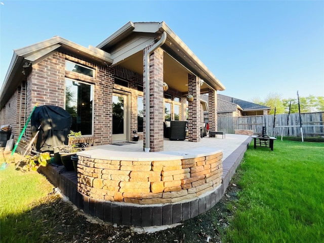 2507 Elmwood Trl, Katy, TX 77493 - rear view of property featuring a patio area and brick siding