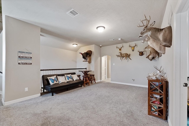 10744 S Lake Mist Ln, Willis, TX 77318 - sitting room with arched walkways, carpet flooring, and baseboards