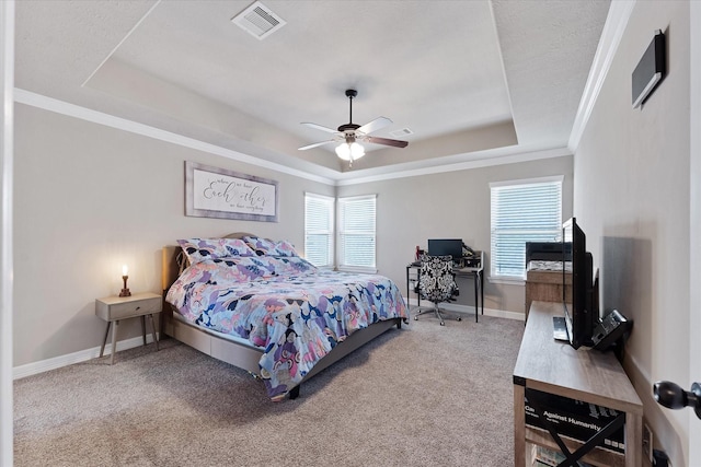 10744 S Lake Mist Ln, Willis, TX 77318 - carpeted bedroom with a raised ceiling, baseboards, ornamental molding, and a ceiling fan
