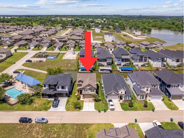 10744 S Lake Mist Ln, Willis, TX 77318 - aerial perspective of suburban area with a nearby body of water and a pool area