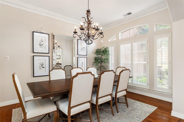5819 Desert Oak Way, Spring, TX 77379 - dining space featuring a chandelier, crown molding, baseboards, and wood finished floors