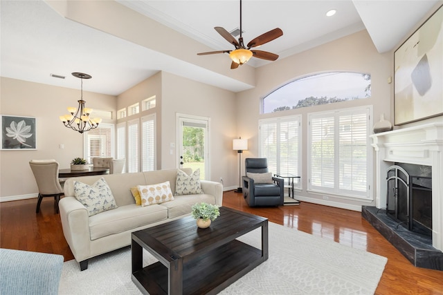 5819 Desert Oak Way, Spring, TX 77379 - living area with a chandelier, wood finished floors, baseboards, ceiling fan, and crown molding