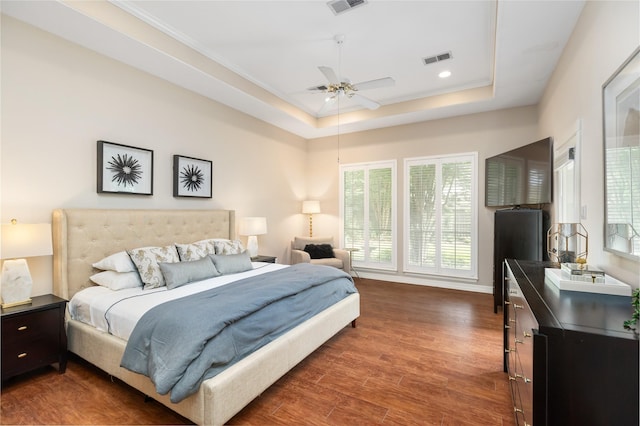5819 Desert Oak Way, Spring, TX 77379 - bedroom with a raised ceiling, wood finished floors, baseboards, and recessed lighting