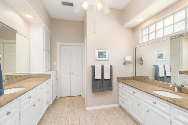 5819 Desert Oak Way, Spring, TX 77379 - full bath with two vanities, ceiling fan, baseboards, and recessed lighting