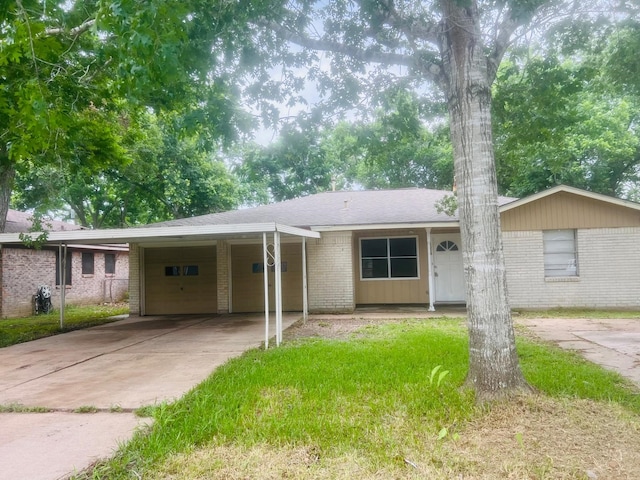 1229 Ramona St, Angleton, TX 77515 - single story home with an attached garage, concrete driveway, brick siding, and an attached carport