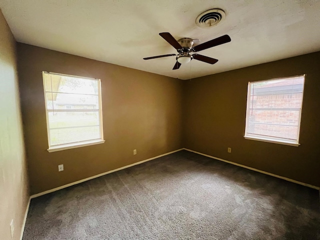 1229 Ramona St, Angleton, TX 77515 - carpeted empty room with plenty of natural light, baseboards, and a ceiling fan