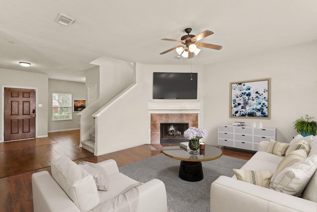 6010 Twin Crk, Missouri City, TX 77459 - living area featuring ceiling fan, a fireplace, wood finished floors, and stairway