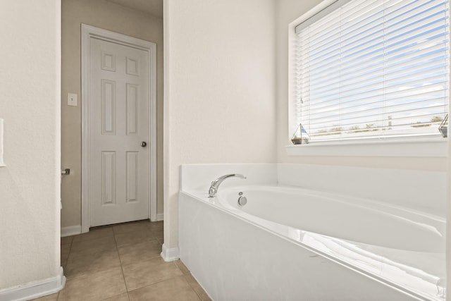 6010 Twin Crk, Missouri City, TX 77459 - full bath with tile patterned flooring, a garden tub, and baseboards