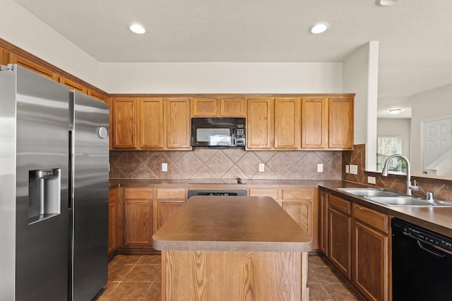 6010 Twin Crk, Missouri City, TX 77459 - kitchen featuring black appliances, a sink, a center island, tasteful backsplash, and dark tile patterned flooring