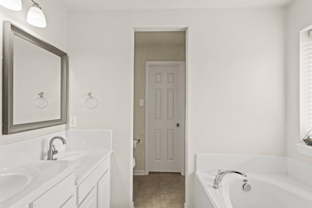 6010 Twin Crk, Missouri City, TX 77459 - bathroom featuring tile patterned flooring, a garden tub, toilet, and double vanity