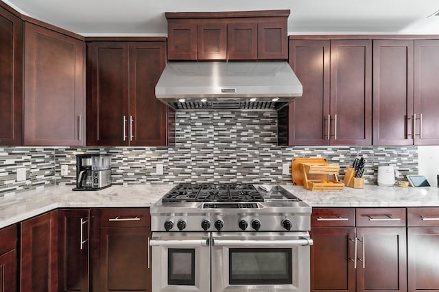 4301 Vivian St, Bellaire, TX 77401 - kitchen with double oven range, extractor fan, decorative backsplash, and light stone counters