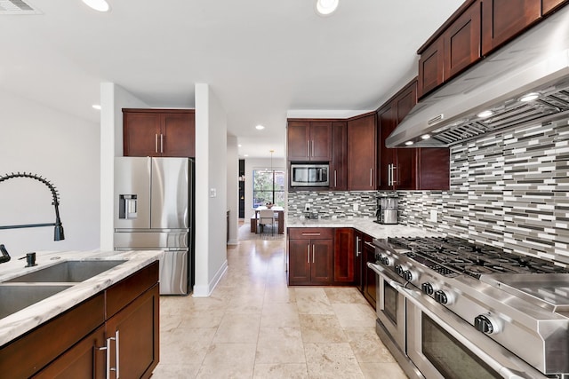4301 Vivian St, Bellaire, TX 77401 - kitchen featuring appliances with stainless steel finishes, under cabinet range hood, tasteful backsplash, a sink, and recessed lighting