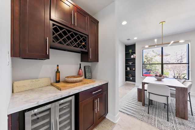 4301 Vivian St, Bellaire, TX 77401 - indoor dry bar with baseboards, pendant lighting, light tile patterned floors, recessed lighting, and wine cooler