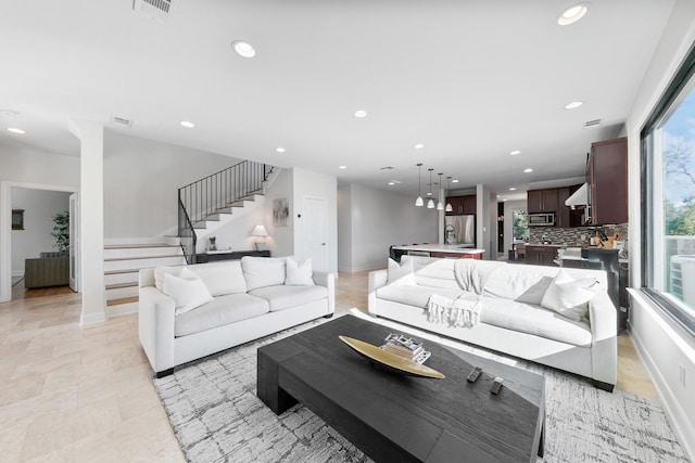 4301 Vivian St, Bellaire, TX 77401 - living room featuring recessed lighting, stairs, healthy amount of natural light, and baseboards
