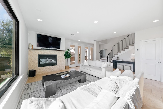 4301 Vivian St, Bellaire, TX 77401 - living area featuring plenty of natural light, stairs, recessed lighting, and a glass covered fireplace