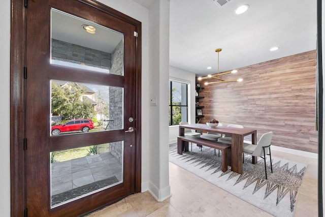 4301 Vivian St, Bellaire, TX 77401 - entrance foyer featuring baseboards, recessed lighting, a chandelier, and an accent wall