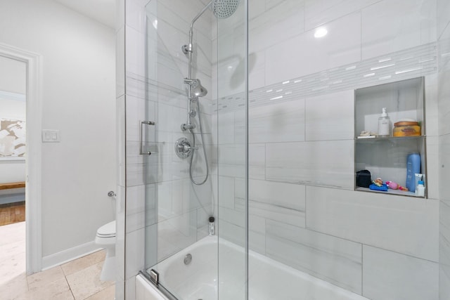 4301 Vivian St, Bellaire, TX 77401 - bathroom with combined bath / shower with glass door, toilet, baseboards, and tile patterned flooring