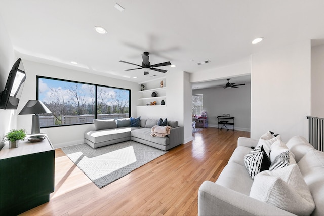 4301 Vivian St, Bellaire, TX 77401 - living room with a ceiling fan, light wood-style floors, recessed lighting, and baseboards