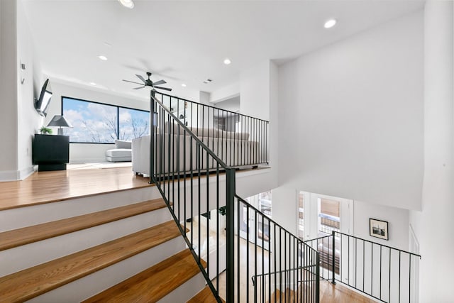 4301 Vivian St, Bellaire, TX 77401 - stairway with a ceiling fan, wood finished floors, recessed lighting, and baseboards