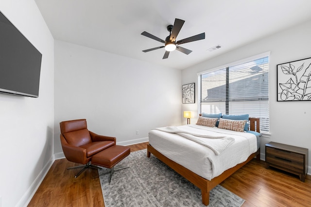 4301 Vivian St, Bellaire, TX 77401 - bedroom featuring wood finished floors, baseboards, and ceiling fan