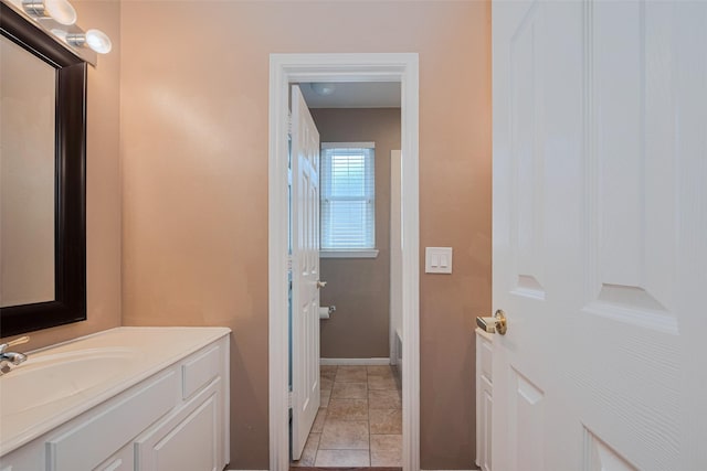 11606 Canyon Breeze Dr, Tomball, TX 77377 - full bathroom featuring vanity, baseboards, and stone tile floors