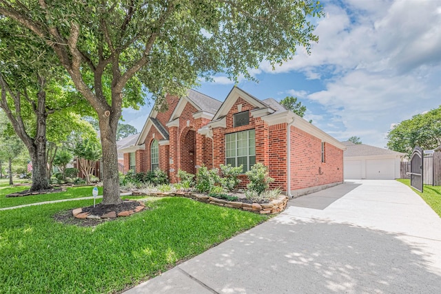 11606 Canyon Breeze Dr, Tomball, TX 77377 - view of front facade with brick siding, a garage, and an outdoor structure