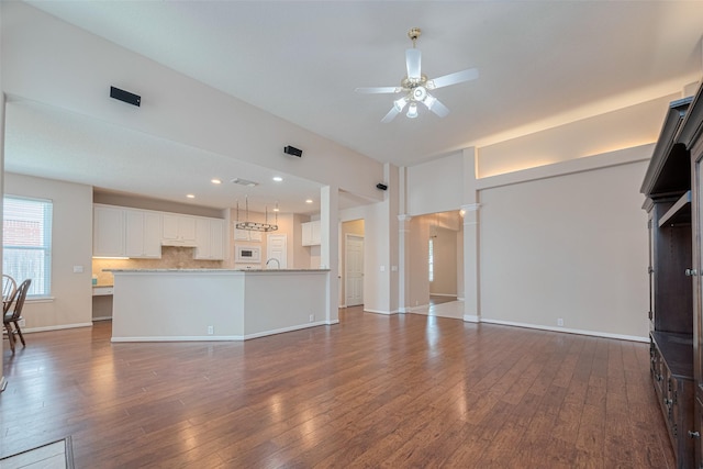 11606 Canyon Breeze Dr, Tomball, TX 77377 - unfurnished living room featuring a ceiling fan, dark wood finished floors, a sink, baseboards, and recessed lighting
