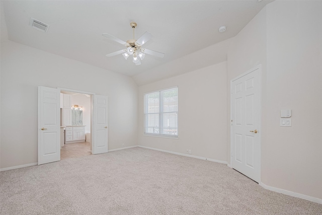 11606 Canyon Breeze Dr, Tomball, TX 77377 - unfurnished bedroom with light colored carpet, baseboards, lofted ceiling, ensuite bathroom, and ceiling fan