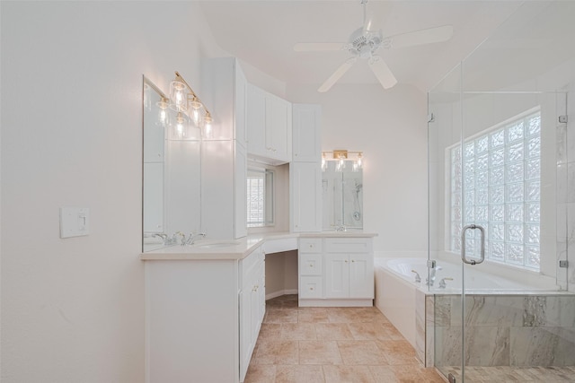 11606 Canyon Breeze Dr, Tomball, TX 77377 - full bathroom with two vanities, a bath, a shower stall, and ceiling fan