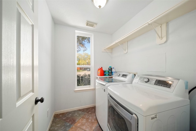 2111 Scenic Hollow Ct, Katy, TX 77450 - laundry room with washing machine and dryer and baseboards