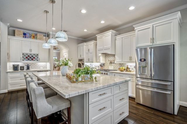 20103 Kirkstone Terrace Ct, Spring, TX 77379 - kitchen featuring stainless steel appliances, white cabinetry, tasteful backsplash, recessed lighting, and ornamental molding