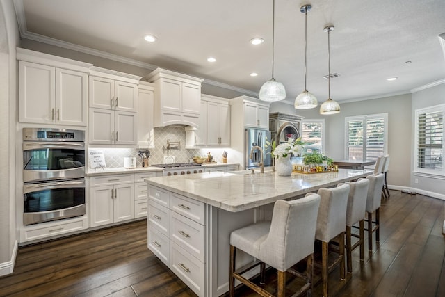 20103 Kirkstone Terrace Ct, Spring, TX 77379 - kitchen with appliances with stainless steel finishes, dark wood-style floors, ornamental molding, white cabinetry, and recessed lighting