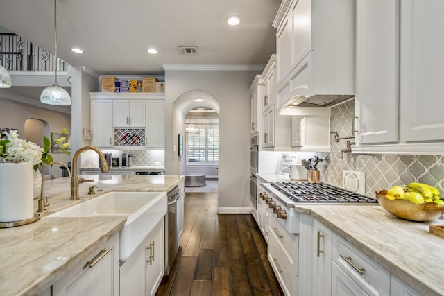 20103 Kirkstone Terrace Ct, Spring, TX 77379 - kitchen featuring ornamental molding, baseboards, white cabinetry, a sink, and gas cooktop