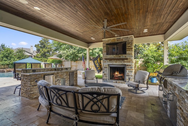 20103 Kirkstone Terrace Ct, Spring, TX 77379 - view of patio featuring an outdoor living space with a fireplace
