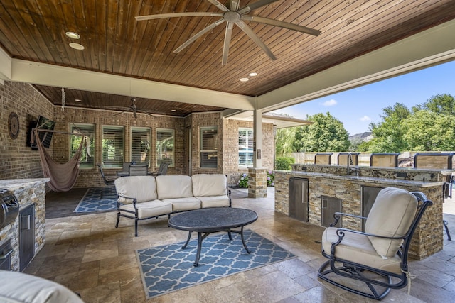 20103 Kirkstone Terrace Ct, Spring, TX 77379 - view of patio featuring ceiling fan, an outdoor kitchen, and an outdoor hangout area
