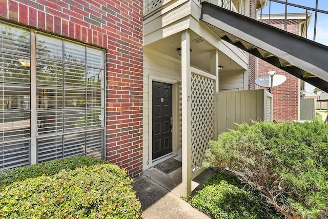 8055 Cambridge St Unit 21, Houston, TX 77054 - view of exterior entry featuring brick siding